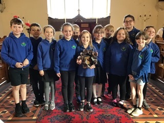 Ysgol Carno pupils with the Wreath of Respect at St Johns Church in Carno on October 1, 2021.